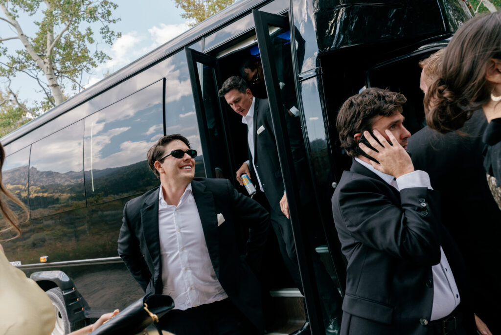 groomsmen exiting Charleston wedding bus