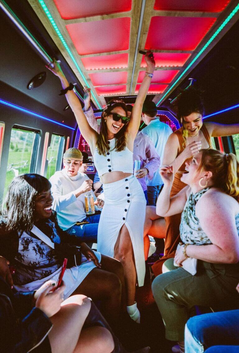 The inside of a party bus in charleston SC with multi-colored mood lighting